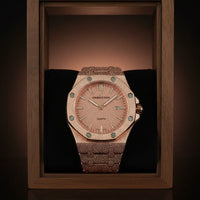 Luxury watch with wooden strap in a wooden display case on a dark background