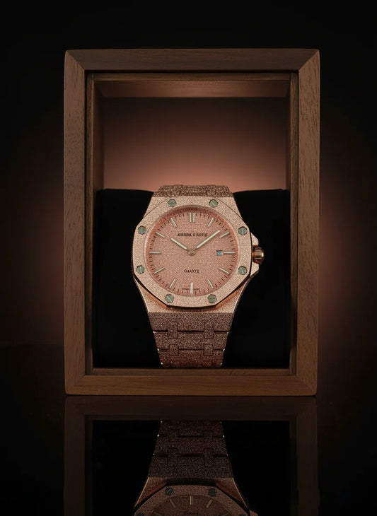 Luxury watch with a wooden strap in a wooden box on a reflective surface.