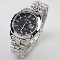Silver watch with black dial featuring diamond accents on a light gray background