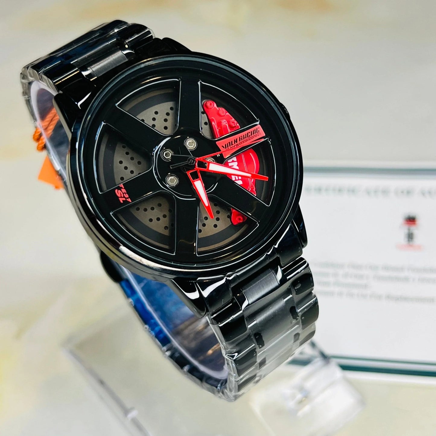 Black watch with red accents on a white background